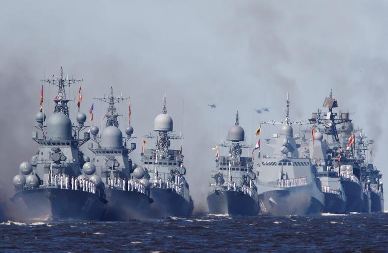 Russian warships sail during the Navy Day parade in Kronstadt near Saint Petersburg, Russia . REUTERS/Anton Vaganov/Pool